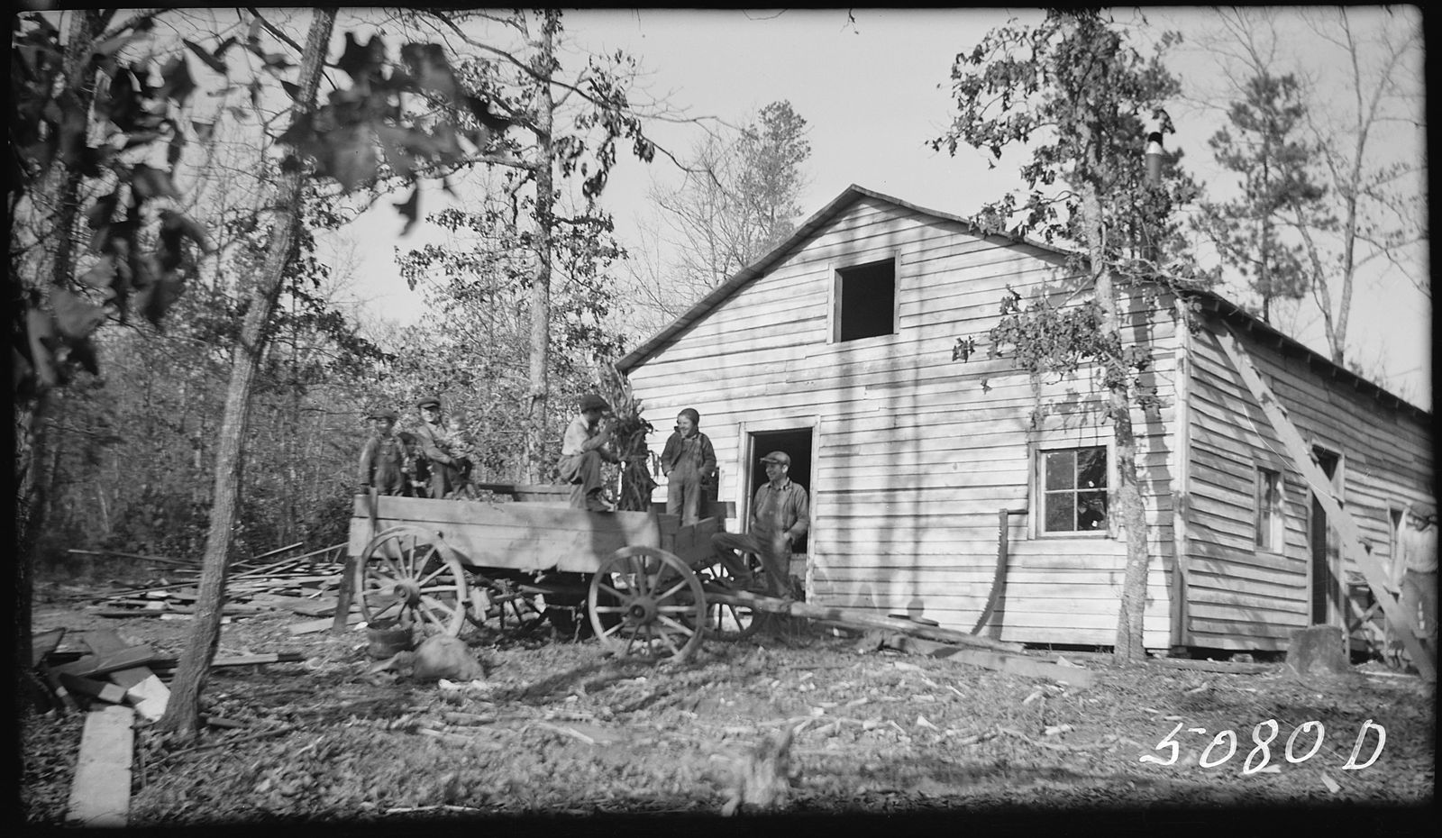 The Hogshed family loading a wagon to leave their home