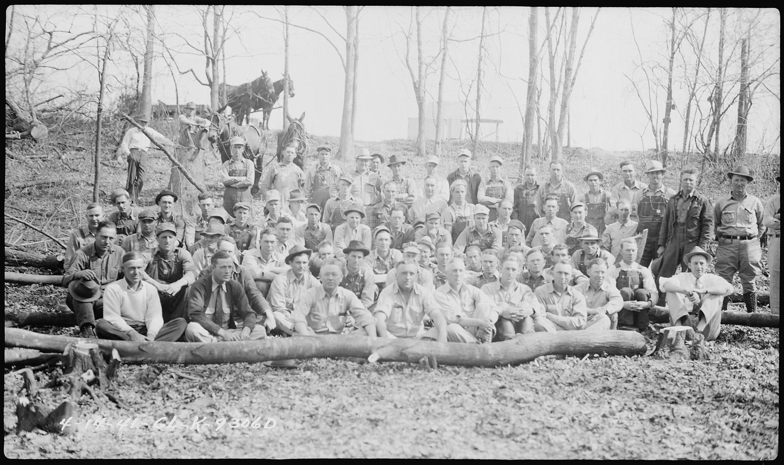 A large TVA reservoir clearance crew seated on logs