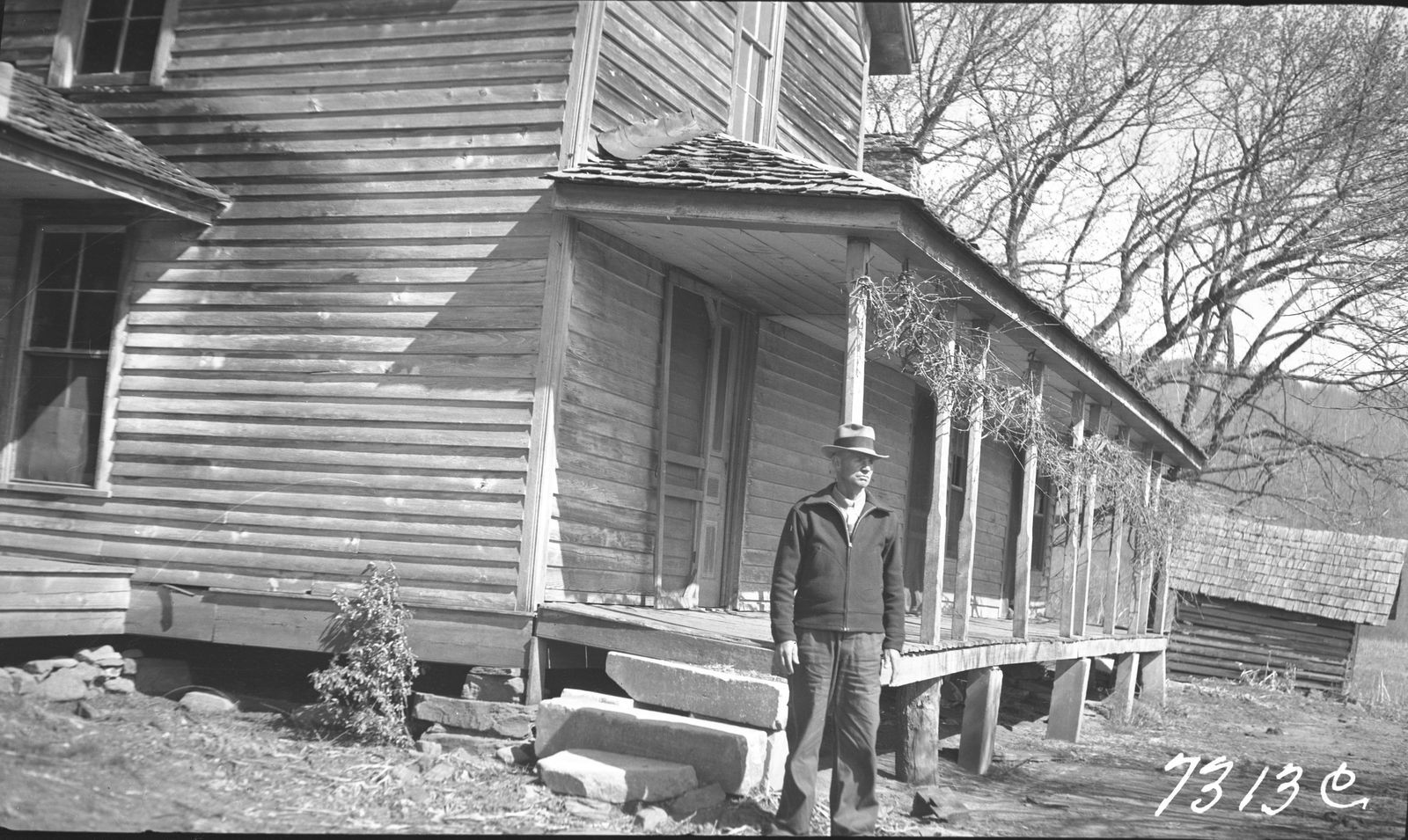 Wiley Ramsey standing by his porch