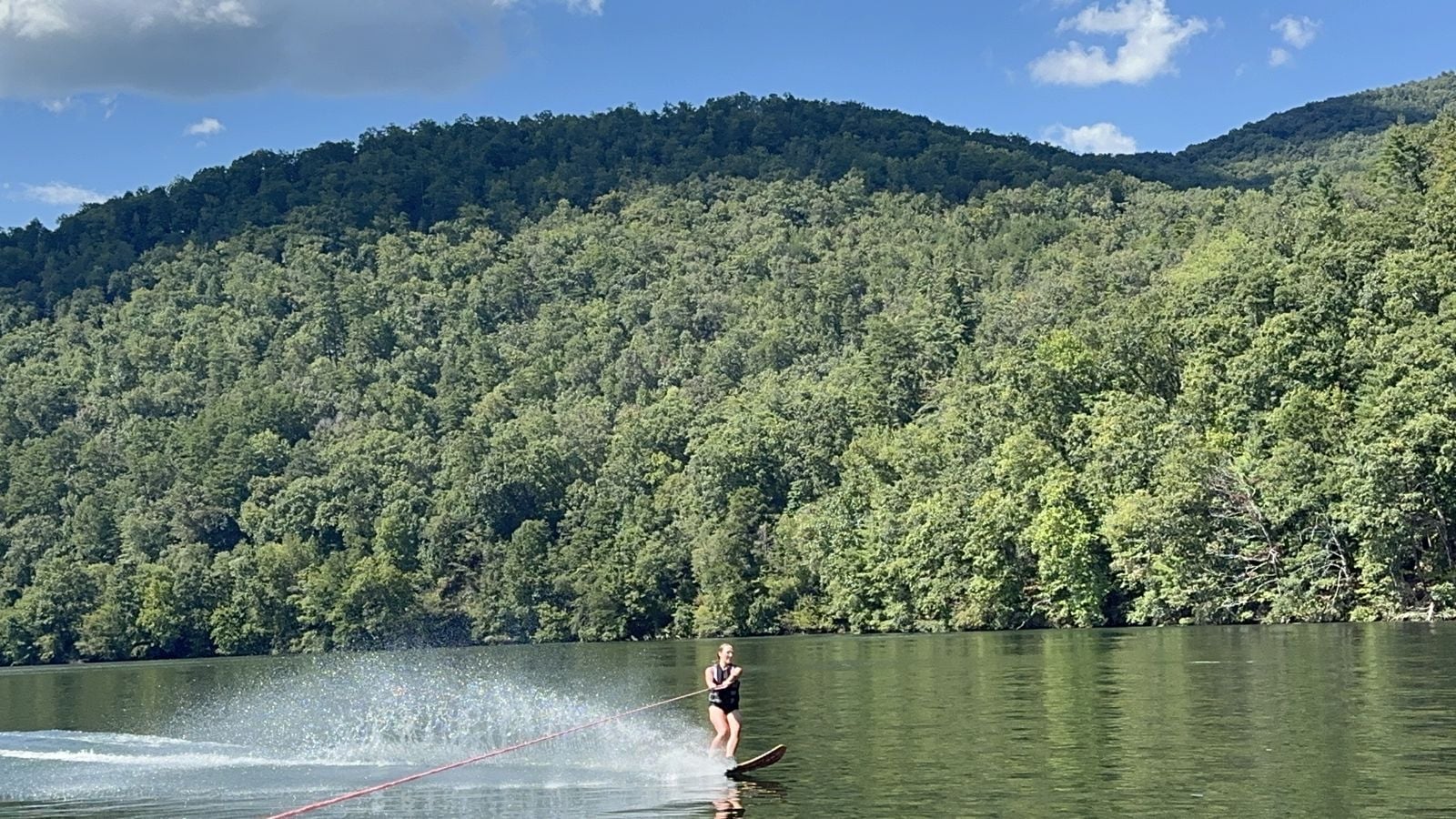 Water-skiing on Lake Apalachia below forested ridges